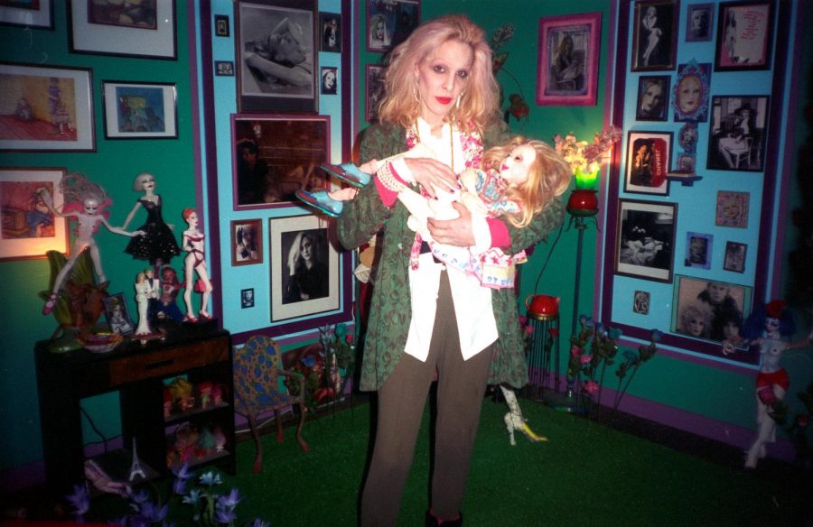 Lankton cradling a doll at her exhibition at the Mattress Factory, 1996.
